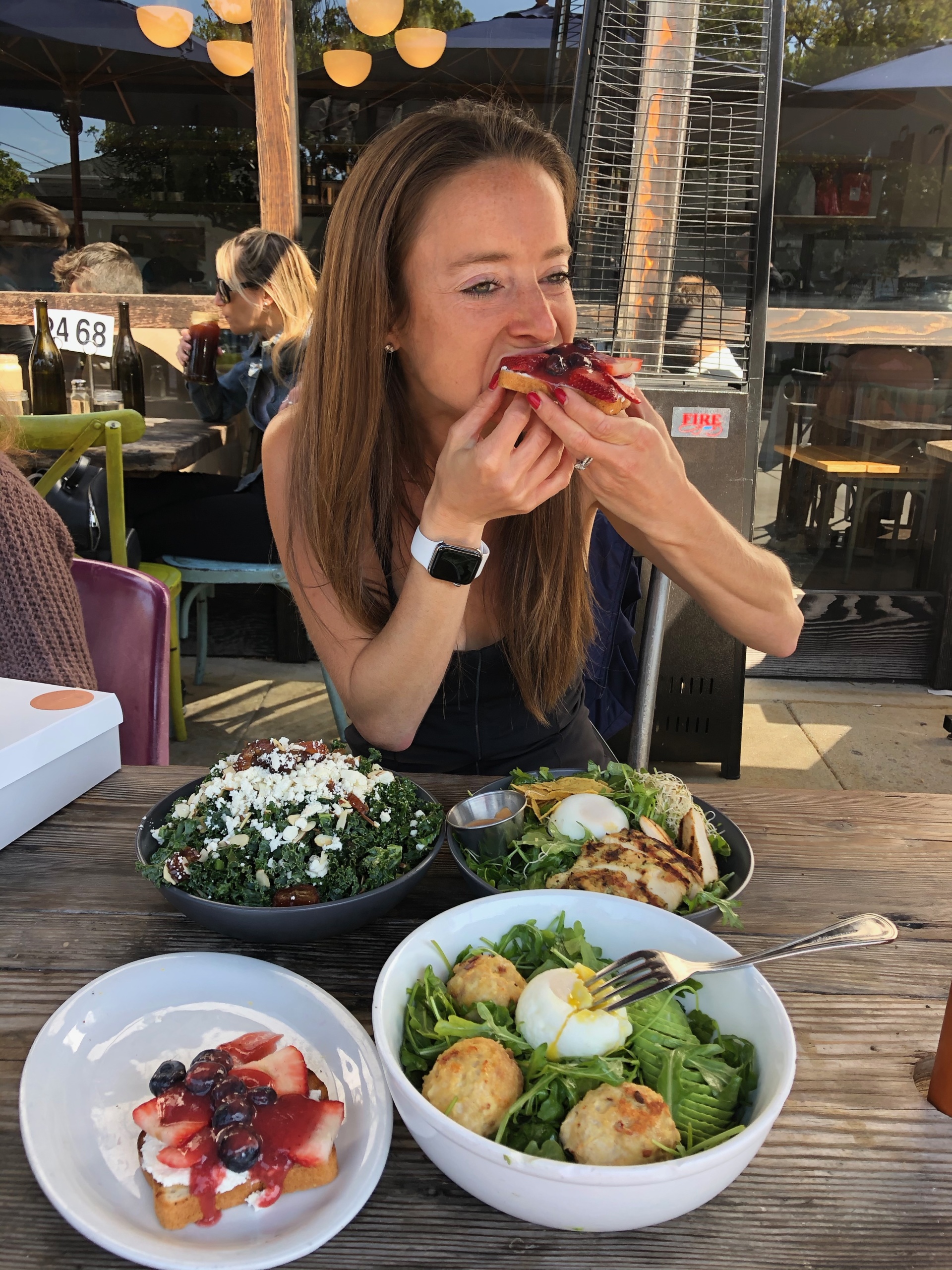 Jackie eating GF toast at Bardonna