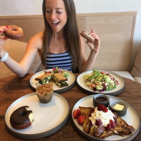 Jackie eating gluten-free donuts from Breadblok