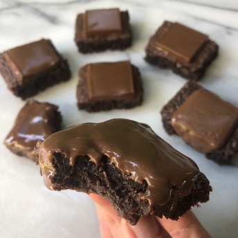 Gluten-free brownies topped with Surge Chocolate