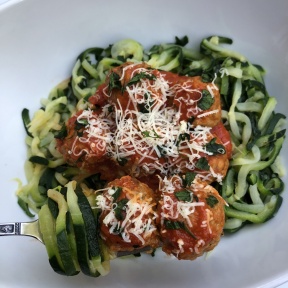 Zoodles and meatballs with parmesan cheese