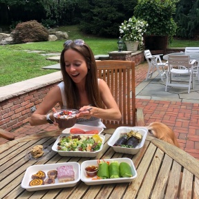 Jackie eating food from Catch A Healthy Habit Cafe