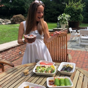 Jackie eating a gluten-free lunch from Catch A Healthy Habit Cafe