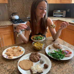 Jackie eating gluten-free food from Skinny Buddha