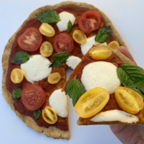 A slice of Cauliflower Crust Pizza