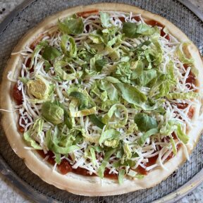 Making gluten-free Shaved Brussels sprouts cheese pizza