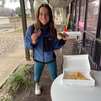 Jackie eating dessert at Dream Bakery in Austin TX