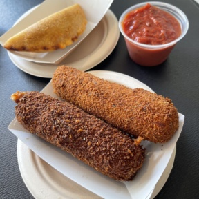 Gluten-free mozzarella sticks and empanada from Dora's Bakery and Bistro