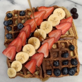 Gluten-free Two Ingredient Waffles with fresh fruit and maple syrup