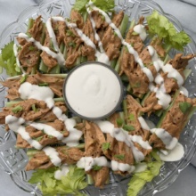 Gluten-free Buffalo Chicken Celery Boats with ranch dressing