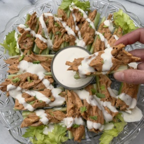 Ready to dip Buffalo Chicken Celery Boats in ranch