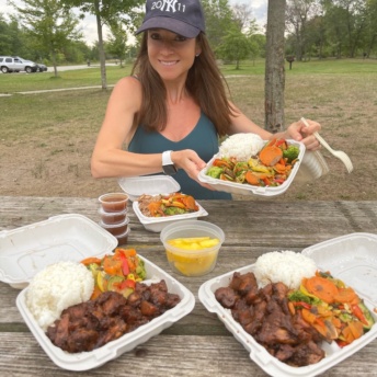 Jackie eating at Hawaiian Bros
