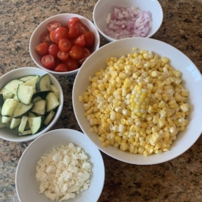Making Corn Tomato Cucumber Salad