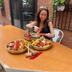 Jackie eating seafood boil at SONO Boil