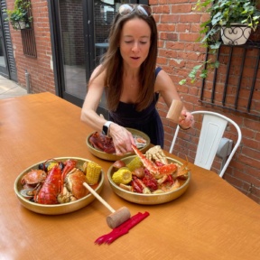 Jackie eating crab at SONO Boil