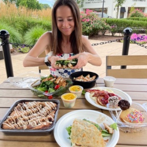 Jackie eating a wrap from Twist Bakery Cafe