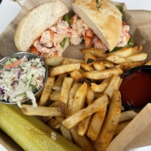 Gluten-free lobster roll with fries from Brix + Brine