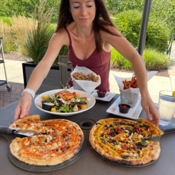 Jackie ready to eat gluten-free pizza at Wicked Restaurant