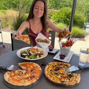 Jackie eating pizza at Wicked Restaurant in Mashpee