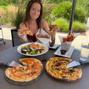 Jackie eating GF pizza at Wicked Restaurant in MA