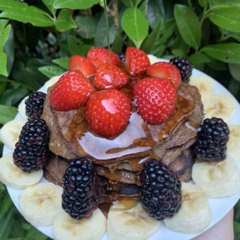 Three ingredient chocolate pancakes with maple syrup