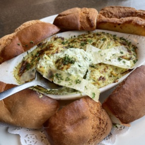 Gluten-free artichoke dip with rolls from Pizza Luce