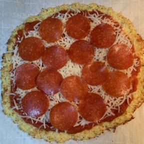 Making pepperoni Cauliflower Pizza