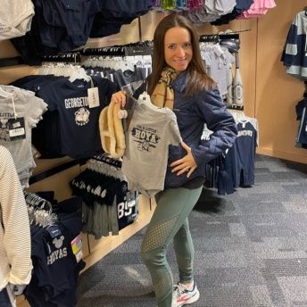 Jackie at Georgetown with a new baby outfit