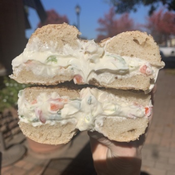 Gluten-free sesame bagel with veggie cream cheese from The Original New York Bagels