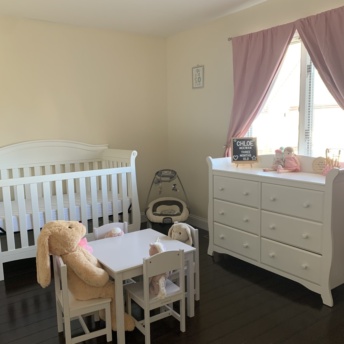 Chloe's nursery! Crib, table, swing, and more