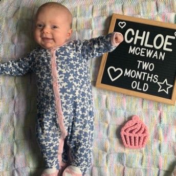 Chloe at 2 months old! Using the felt letter board