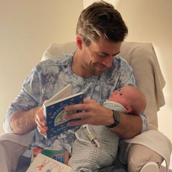 Brendan and Chloe reading in the rocker