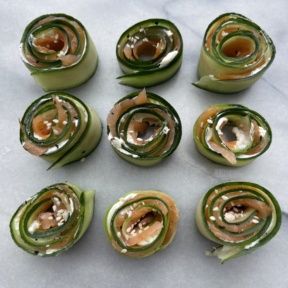 Gluten-free Smoked Salmon Cucumber Roll Ups with sesame seeds
