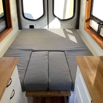 Our bed and couch in the van