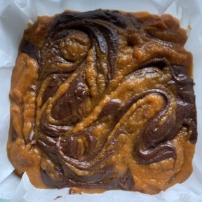 Batter is swirled for Pumpkin Brownies