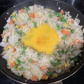 Making Chicken Fried Cauliflower Rice with egg