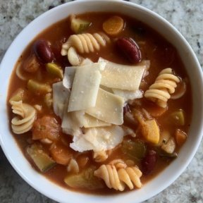 Delicious gluten-free minestrone soup with parmesan