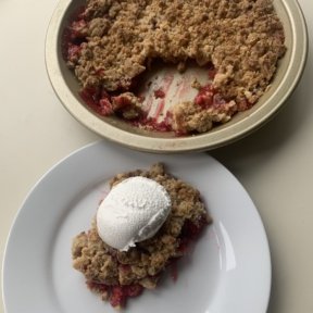 Eating gluten free Raspberry Crumble with a big spoonful of with whipped topping