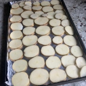 Lining up potato chips to make Baked Potato Chip Nachos