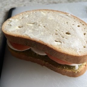 Add softened butter to Mozzarella Pesto Tomato Panini