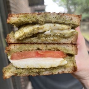 Stack of gluten-free Mozzarella Pesto Tomato Panini
