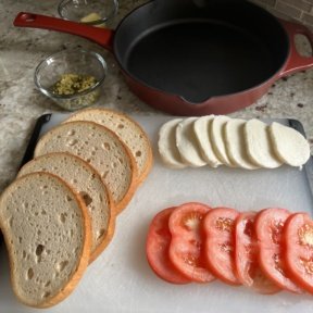 Making a gluten-free Mozzarella Pesto Tomato Panini
