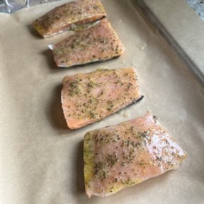 Adding the marinade to Baked Citrus Salmon