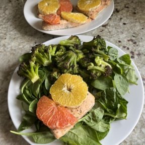 Baked Citrus Salmon on spinach salad with broccoli