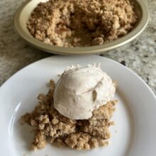 Delicious gluten-free Pear Crumble with a scoop of ice cream